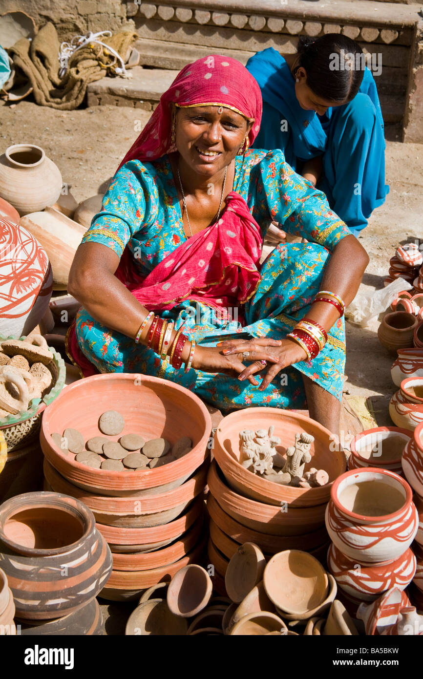 Woman selling pottery in a street, Bikaner, Rajasthan, India Stock