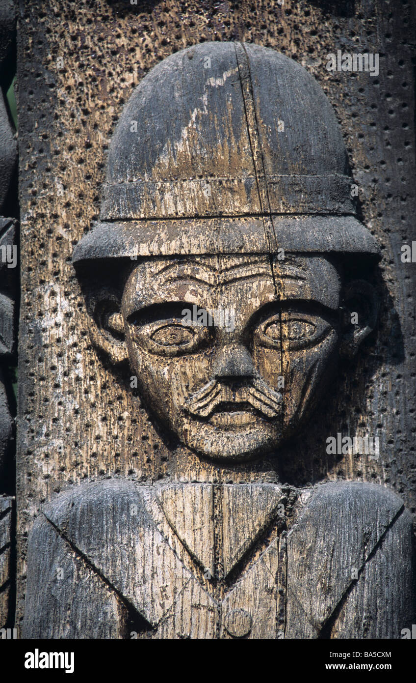 Folk Art Helmeted Figure, Policeman or Soldier, Carved on Wooden Gate, Gateway or Door, Chendu, Transylvania, Romania Stock Photo