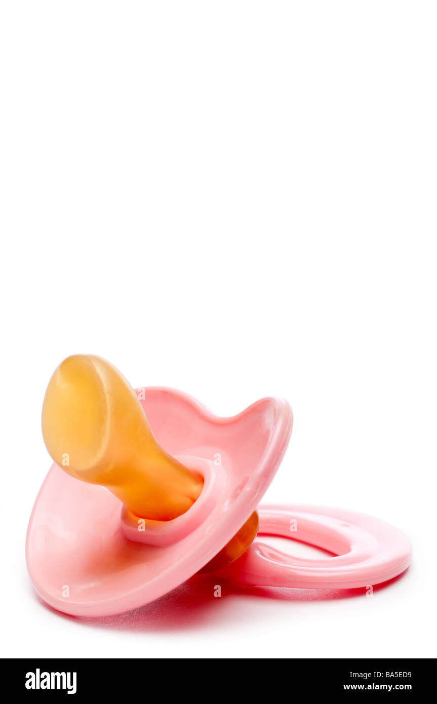 A vertical close up of a pink baby pacifier with space for copy Stock Photo