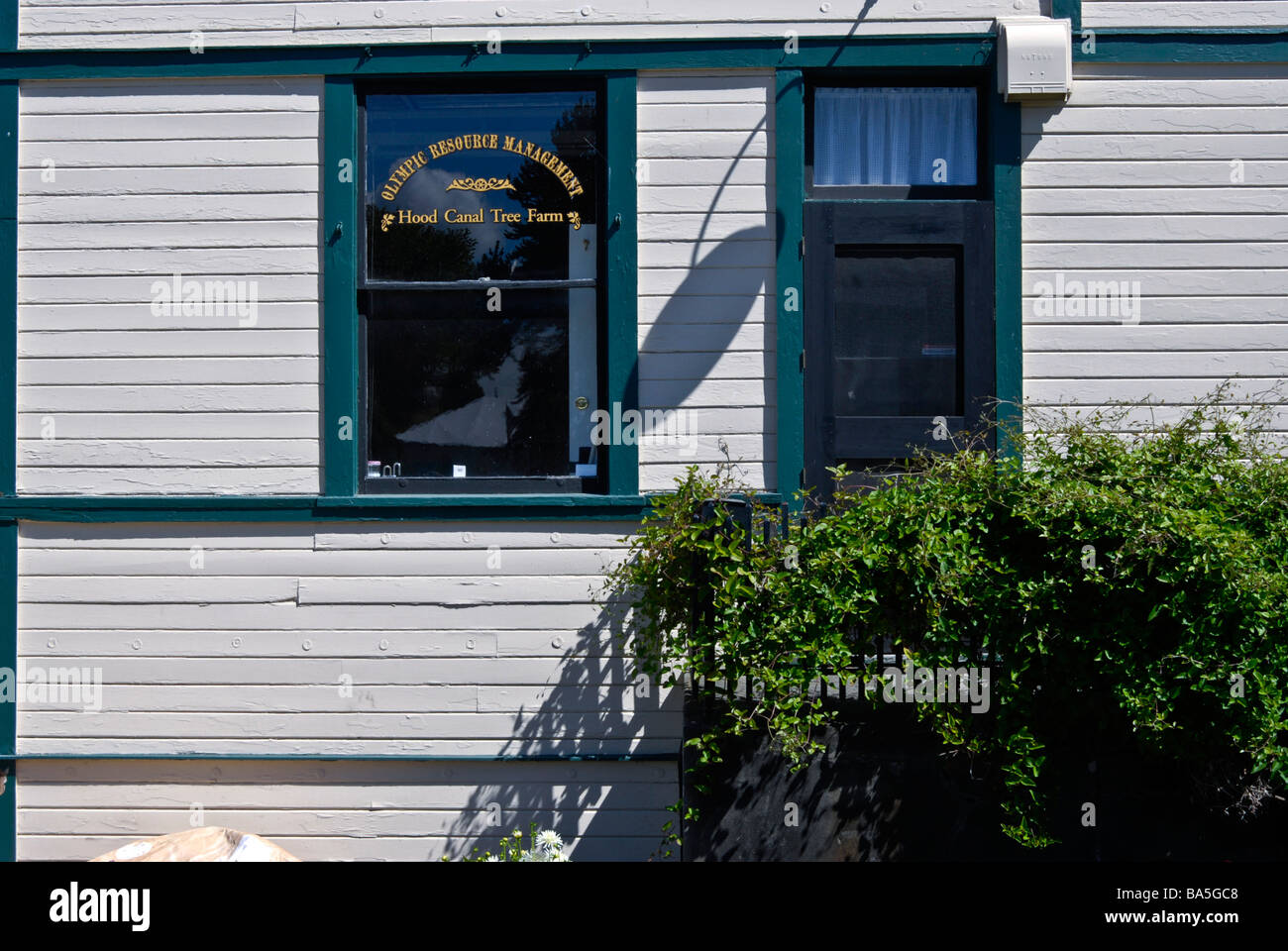 adaptive reuse of an old painted wooden port building in Port Gamble, Washington, USA Stock Photo