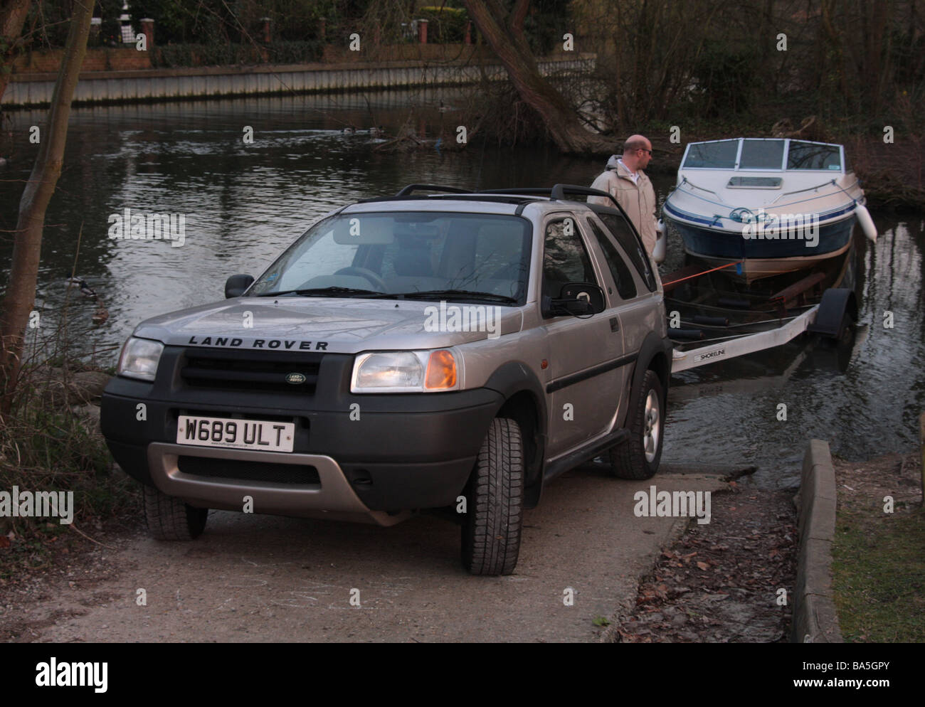 A Landrover Freelander pulling a boat Stock Photo