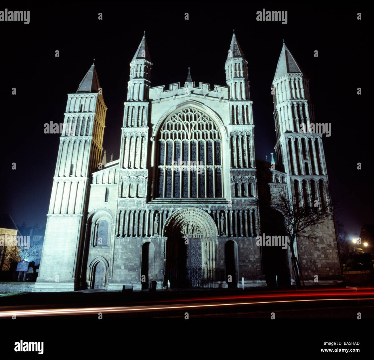 Rochester Cathedral In Kent At Night With The Light Trail Of A Passing 