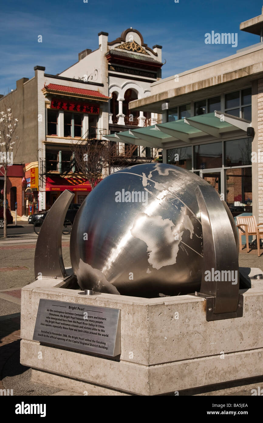 Bright Pearl Rotating globe sculpture in the downtown Victoria BC Canada Stock Photo