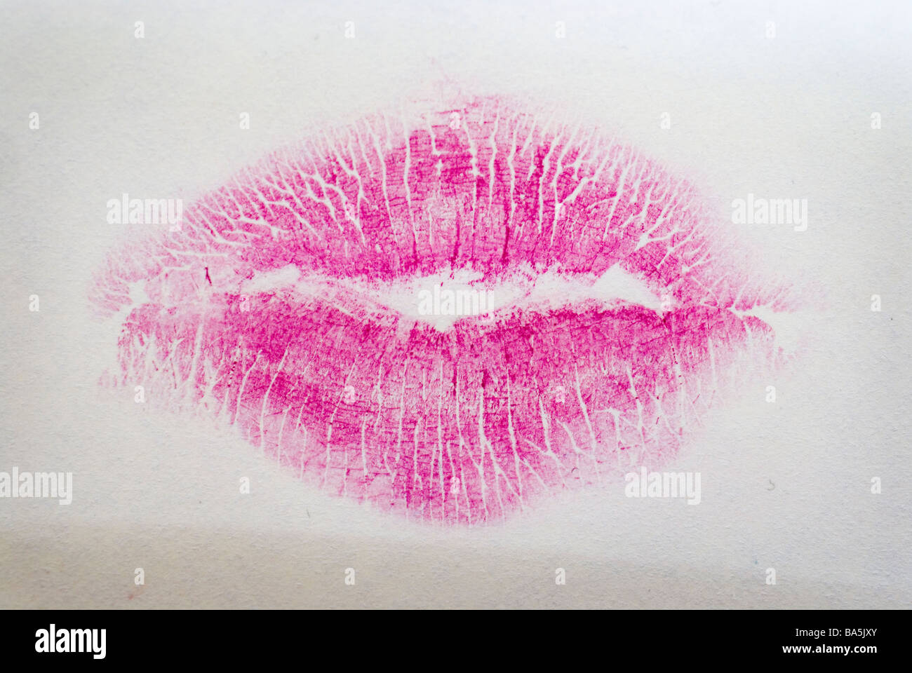 A post it note with a lipstick image of a womens lips, Stock Photo