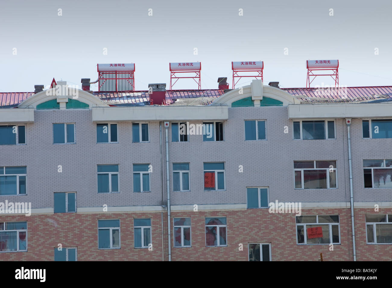 Solar water heaters on the roof of an apartment block in Suihua in northern  China Stock Photo - Alamy