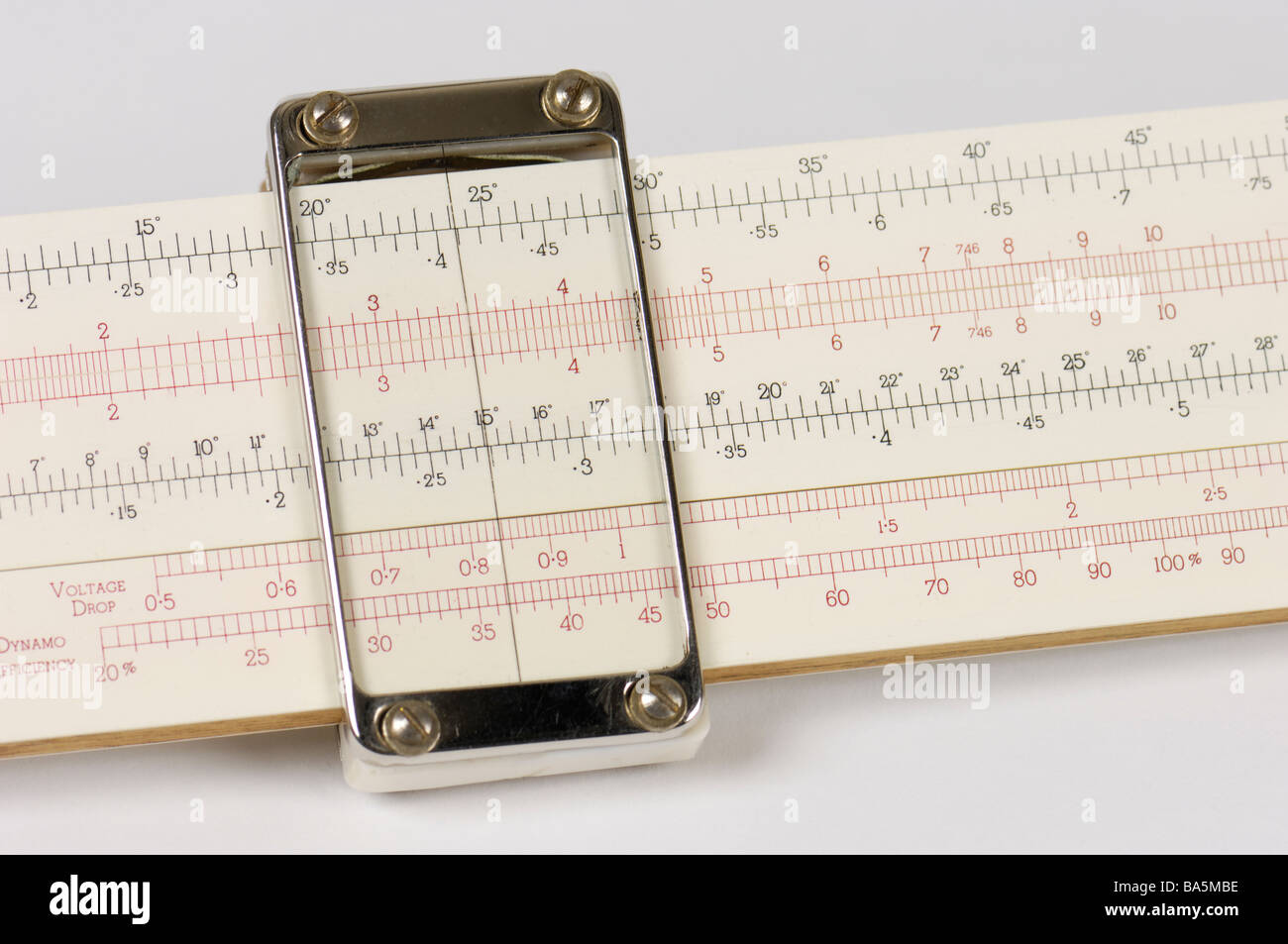 Detail of a slide rule scale and cursor of a slide rule. Stock Photo