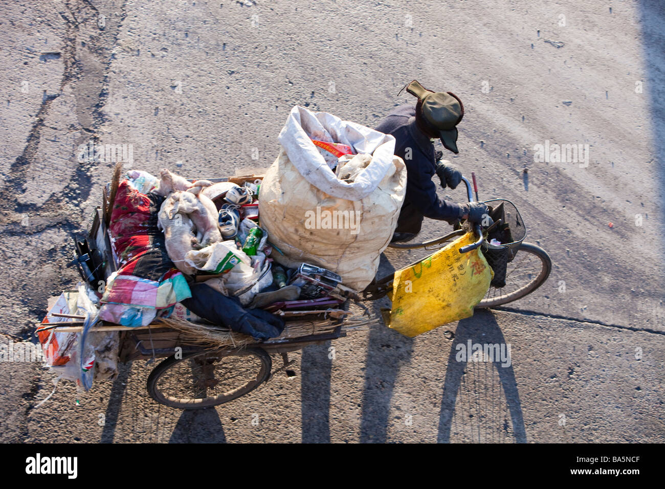 A Chinese peasant recycling rubbish on the streets of Suihua in Heilongjiang Province Northern China Stock Photo