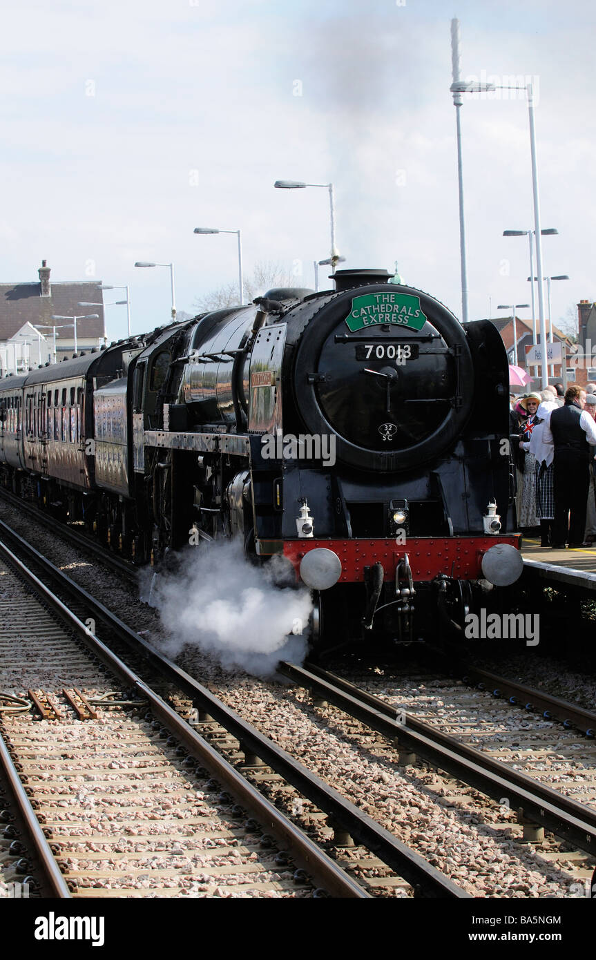 Oliver Cromwell steam engine pulling The Cathedrals Express train pulling into Petersfield railway station Stock Photo