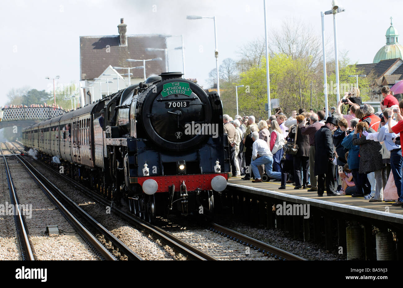 Oliver Cromwell steam engine pulling The Cathedrals Express train pulling into Petersfield railway station Stock Photo
