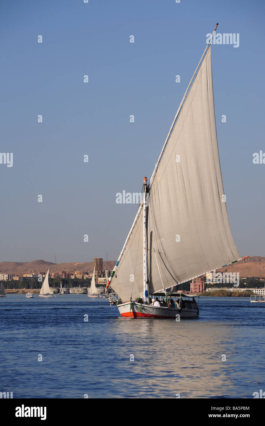 Egypt Aswan felucca boats ply the Nile River Stock Photo - Alamy
