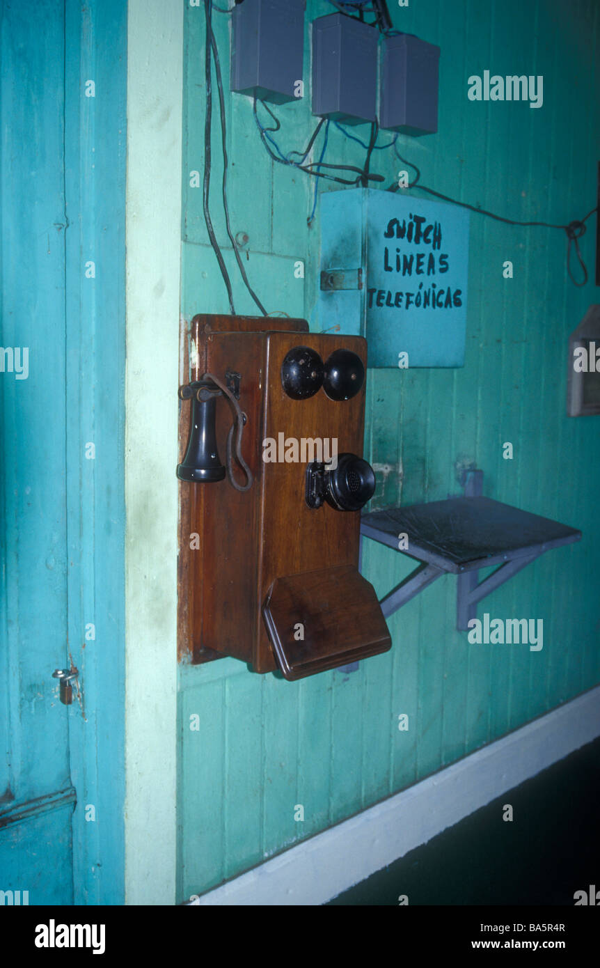 Old wooden telephone mounted on a wall at the Sitio del Niño train station in El Salvador, Central America Stock Photo
