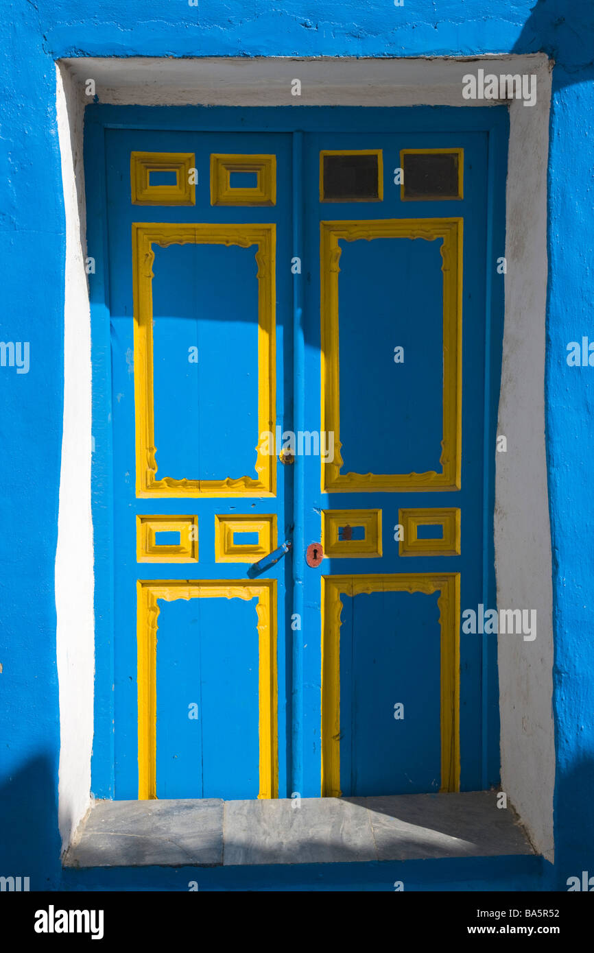 Macharaviaya, Andalucia ,Spain; Blue and yellow door Stock Photo