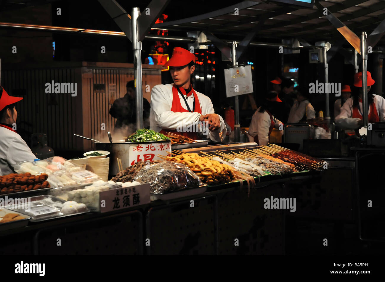 DongHua Men Night Market, Beijing, China. Chinese food stalls at night. Stock Photo
