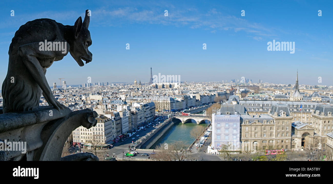View of Paris from top of Notre Dame de Paris Cathedral, with gargoyle in foreground. High resolution panorama. Stock Photo