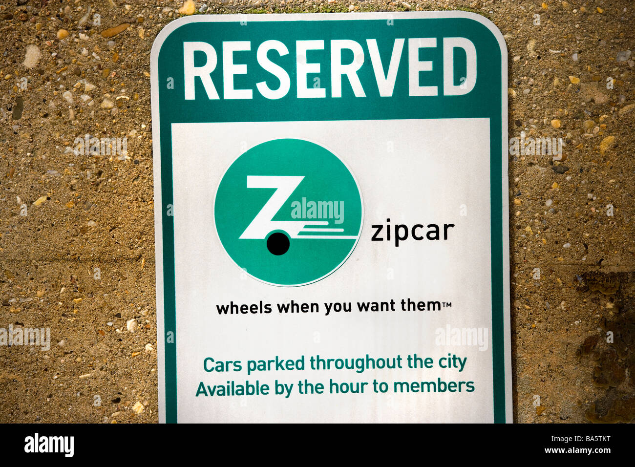 A Zipcar reserved parking sign in Washington DC US Stock Photo