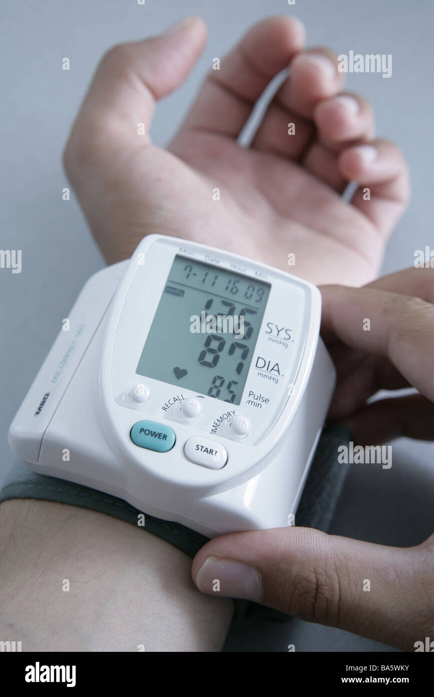 Men'shands wrist blood pressuremeasuring instrument digitally man hands blood pressure