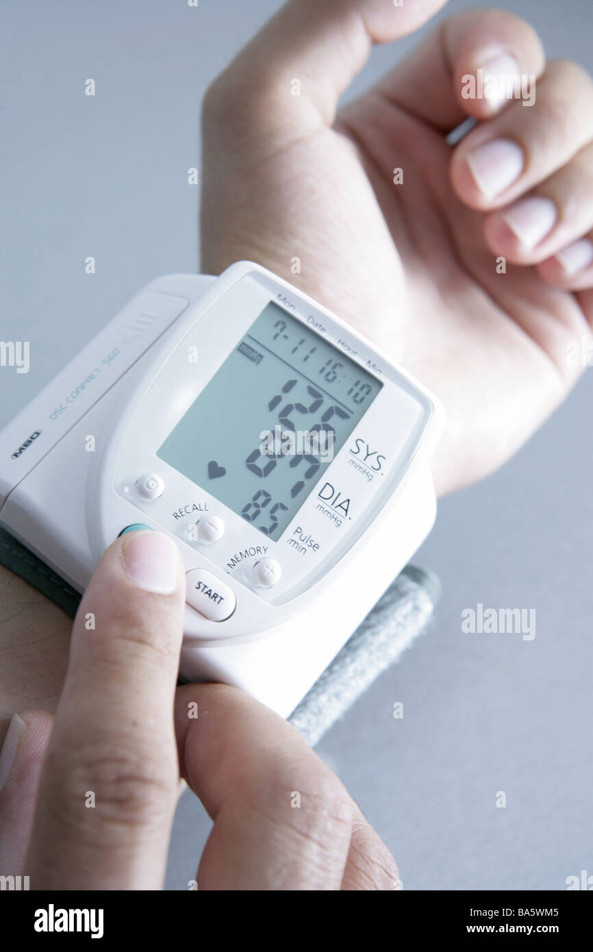 Men'shands wrist blood pressuremeasuring instrument digitally man hands blood pressure