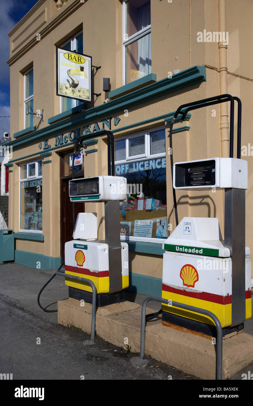 petrol gas pumps on the street outside mccleans combined bar shop petrol station in malin inishowen county donegal Stock Photo
