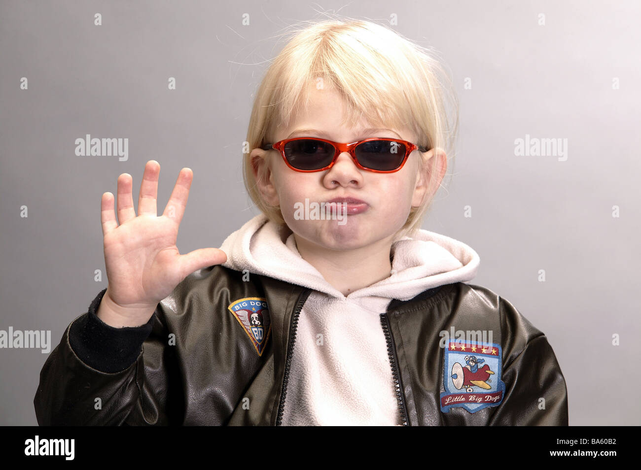 Child sun glass leather-jacket grimace portrait waves boy childhood fun expression facial expression Schnute glasses Stock Photo