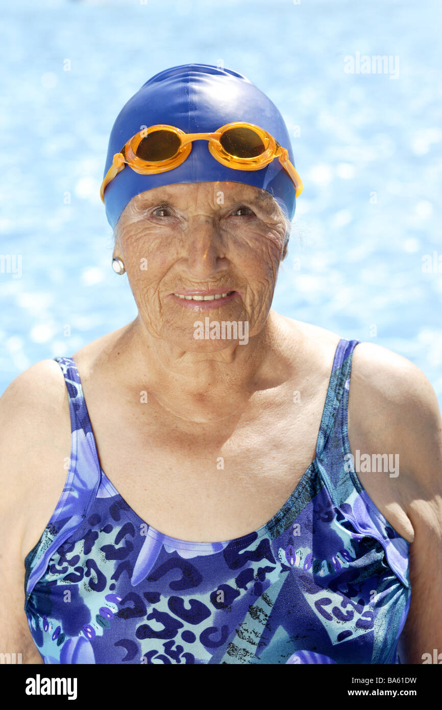 Senior swimsuit bath-cap swimming-glasses portrait series people seniors  woman 70-80 years gaze camera smiles activity vitality Stock Photo - Alamy