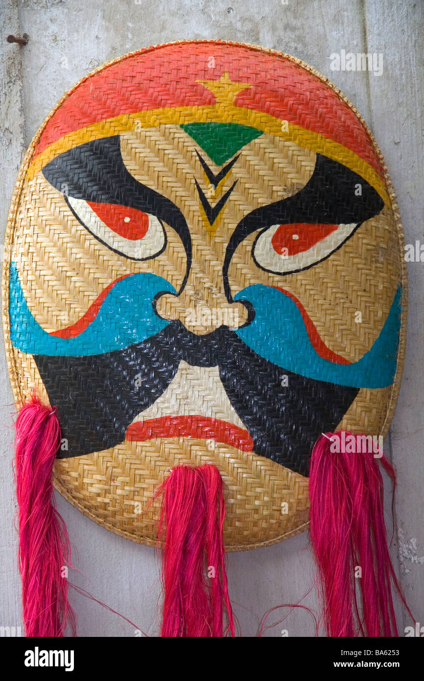 Painted ceremonial masks being sold for Tet in Hanoi Vietnam Stock Photo
