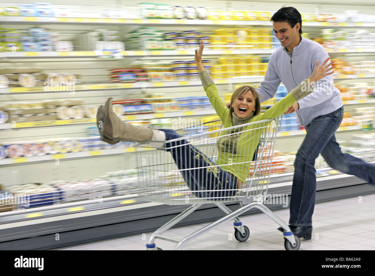 Supermarket pair omitted shopping carts people shopping customers