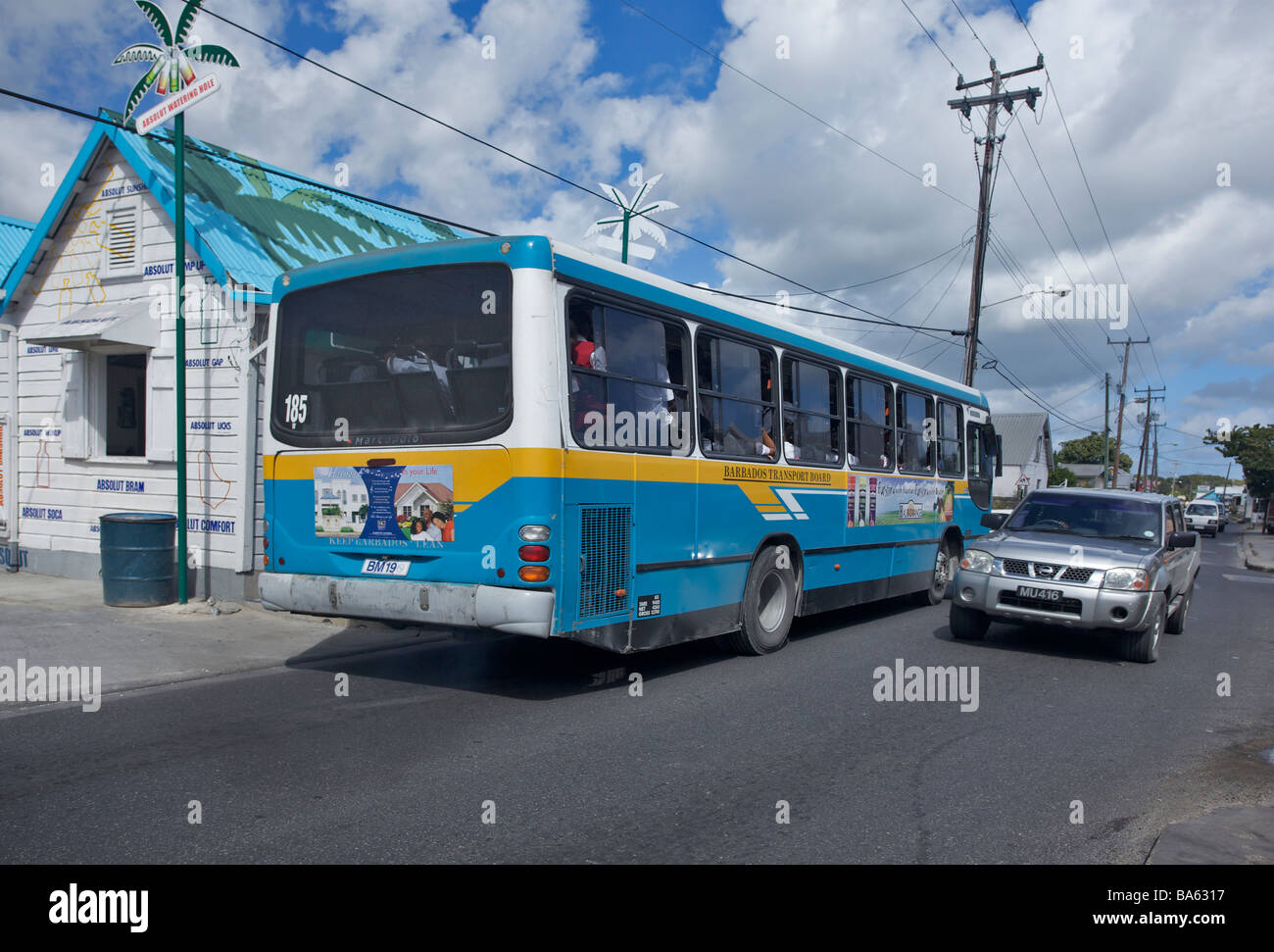 Barbados bus passing a 'rum shop' at St. Lawrence Gap, Barbados, St. Michael, 'West Indies' Stock Photo