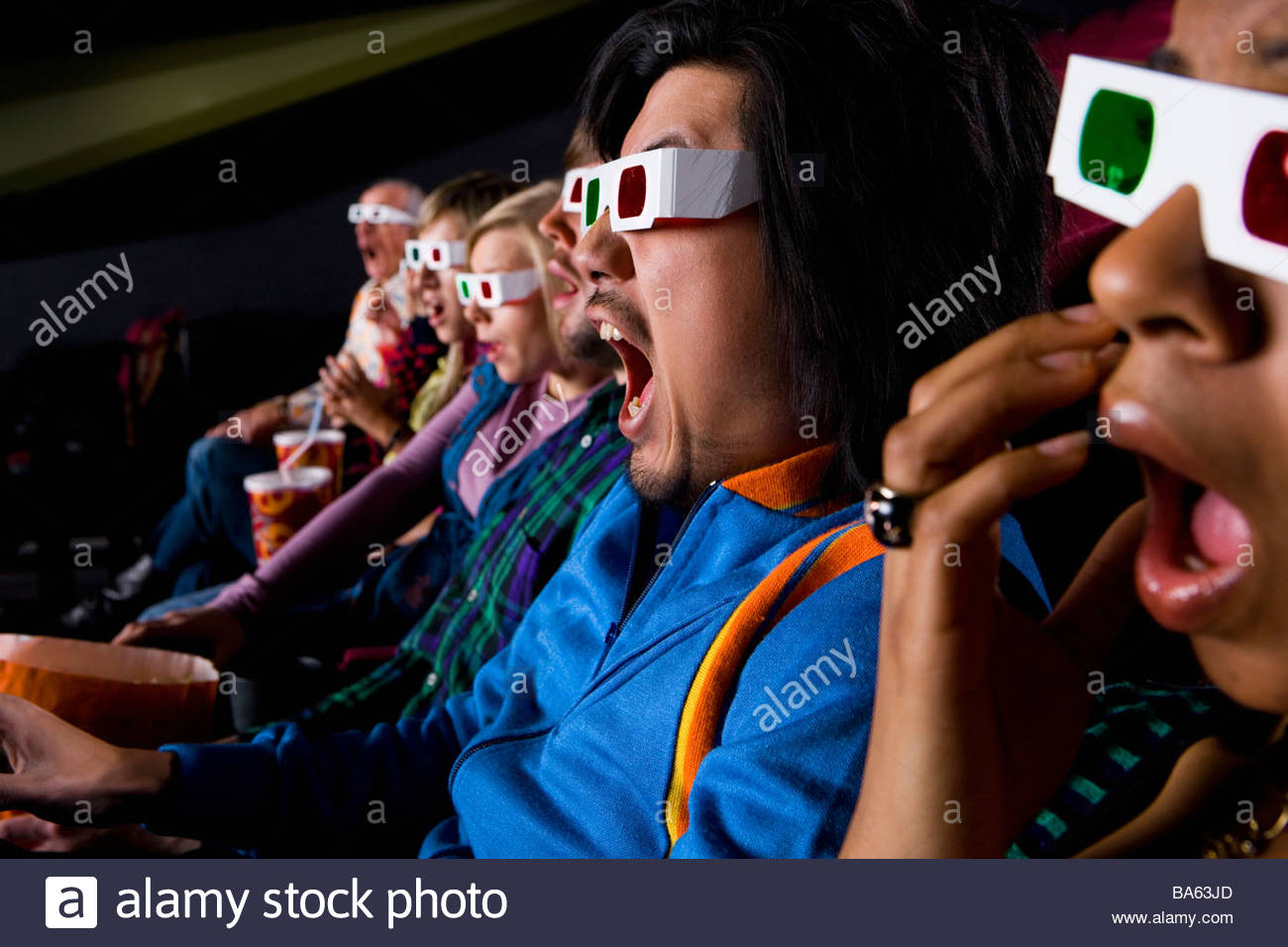 Audience in cinema wearing 3D glasses, closeup Stock Photo 23491509