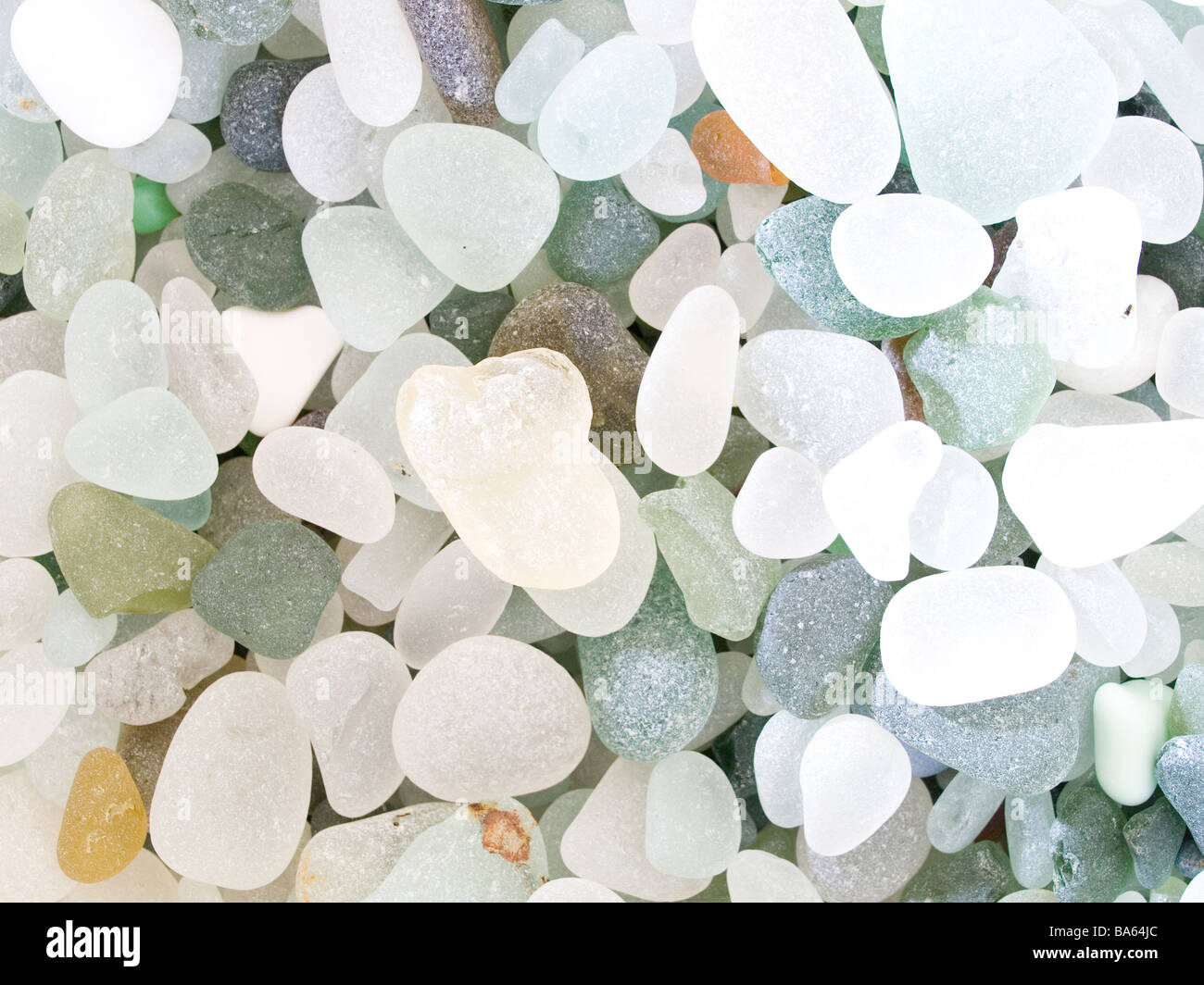 Sea worn glass pebbles collected from a beach displayed en masse also known as 'mermaids tears' and used for making jewellery. Stock Photo