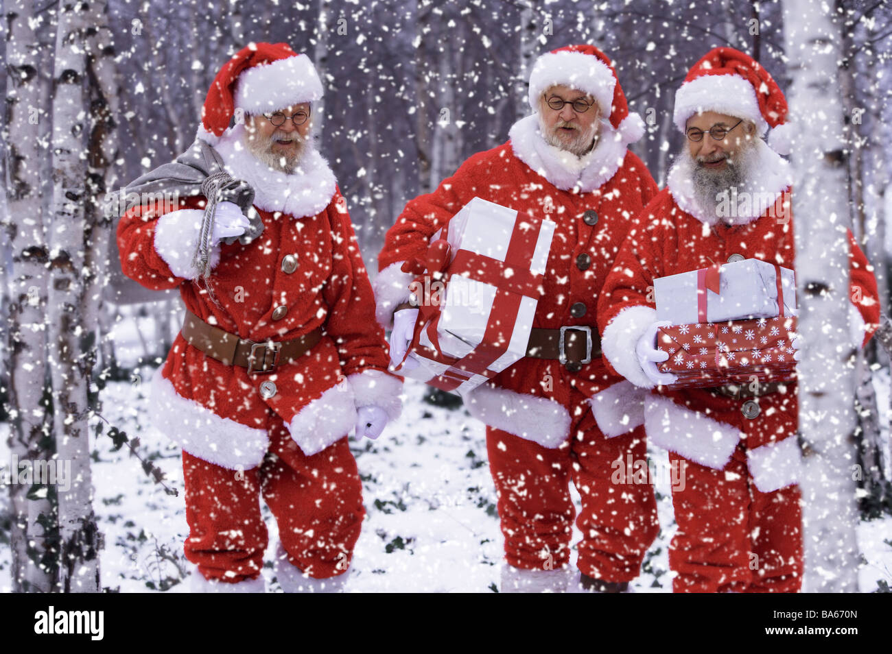 People carry forest flurries Santa Claus gifts Christmas men three disguise outfits glasses beards Christmas-gifts delivers Stock Photo
