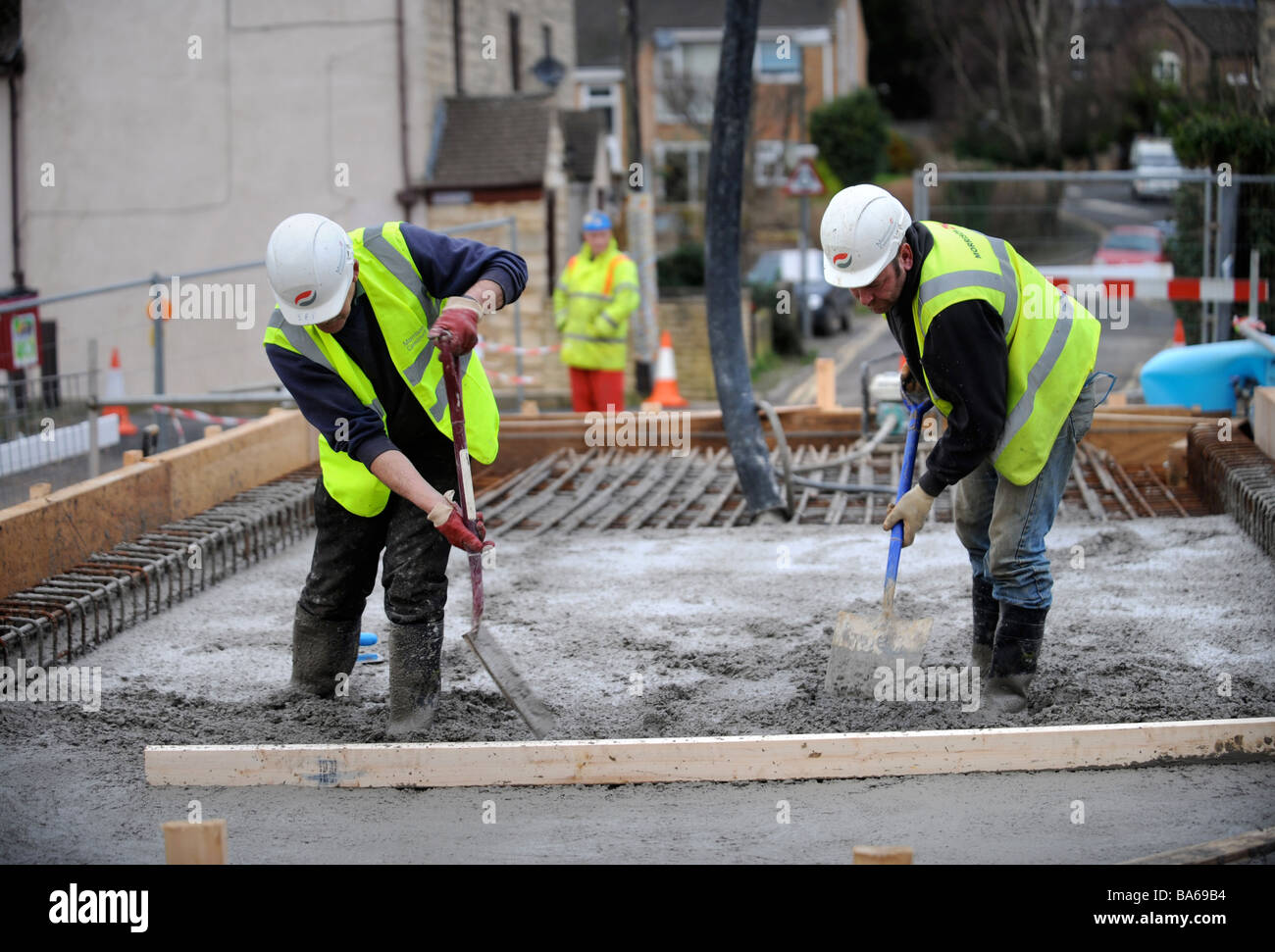 WORKERS LEVELLING PUMPED CONCRETE AT OIL MILLS BRIDGE NEAR STONEHOUSE