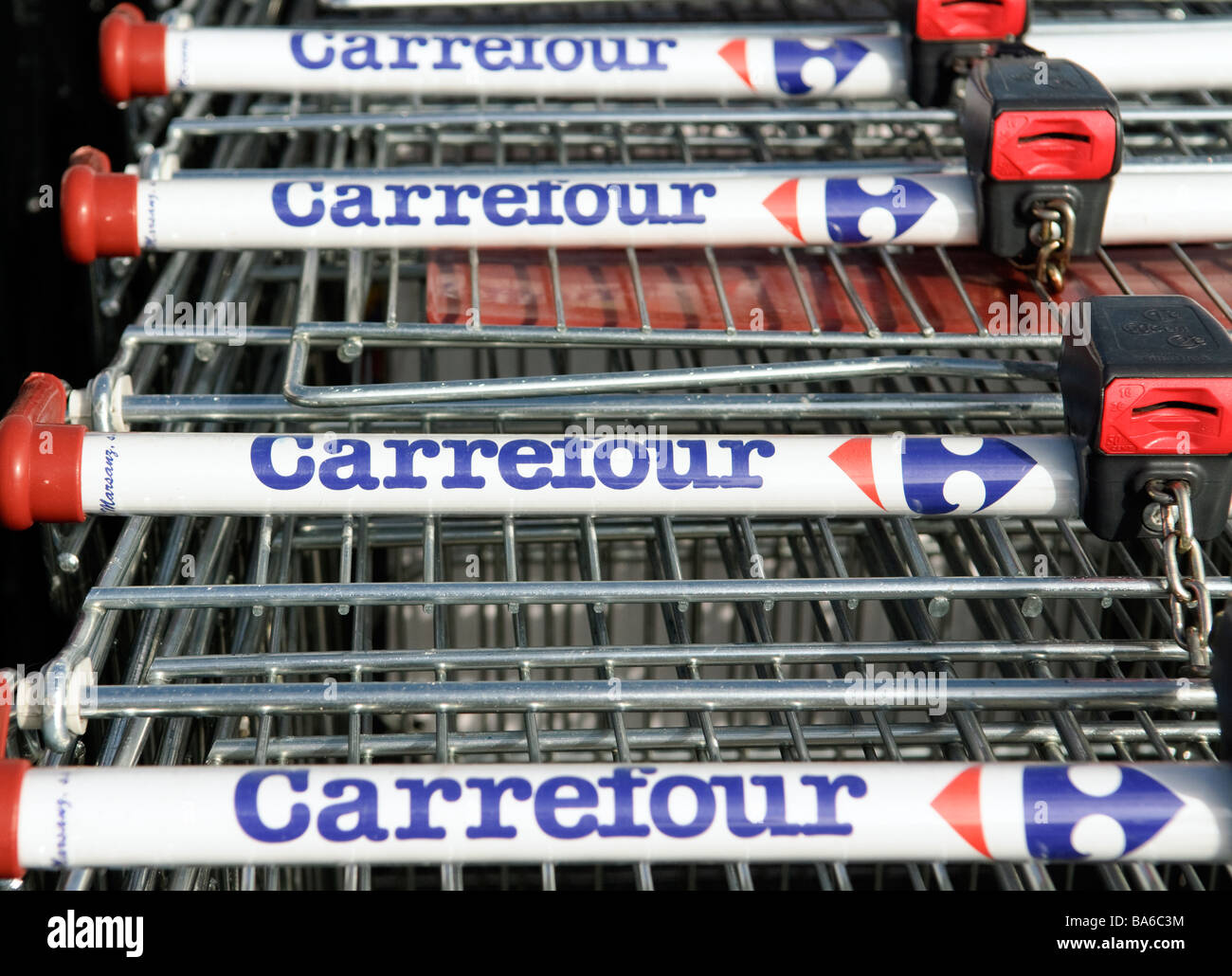 shopping carts bearing the logo of french cash and carry company Carrefour Stock Photo