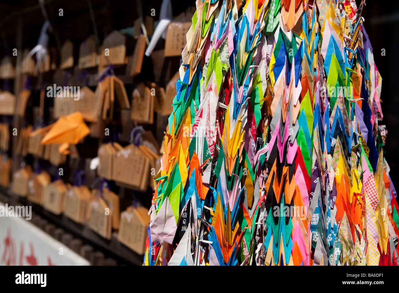 Wishes written near the Shrine & Origami cranes for good luck Stock Photo