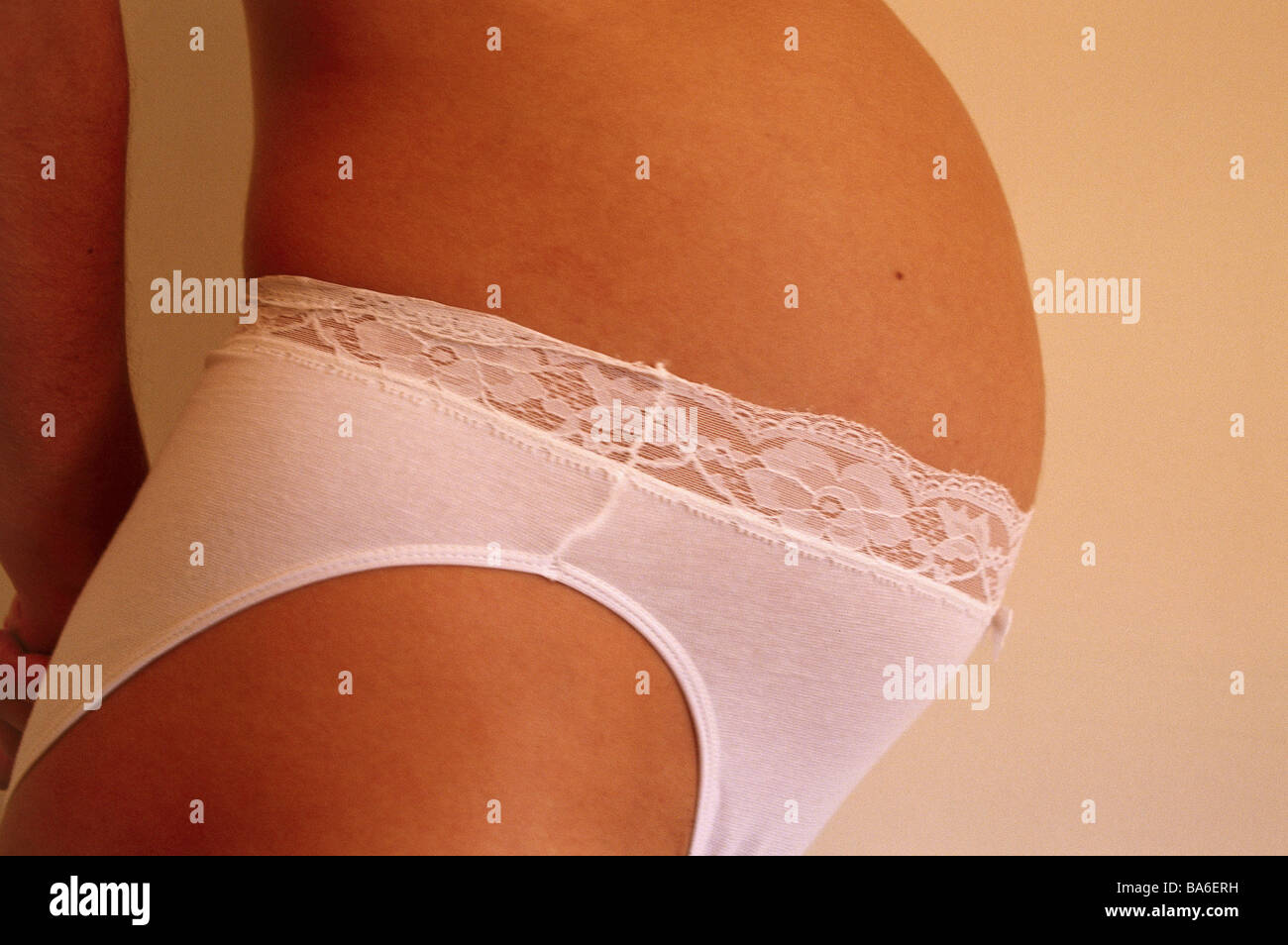 Woman pregnant panties Bauchfrei at the side detail people pregnant 7  months underwear underpants stomach baby-stomach Stock Photo - Alamy