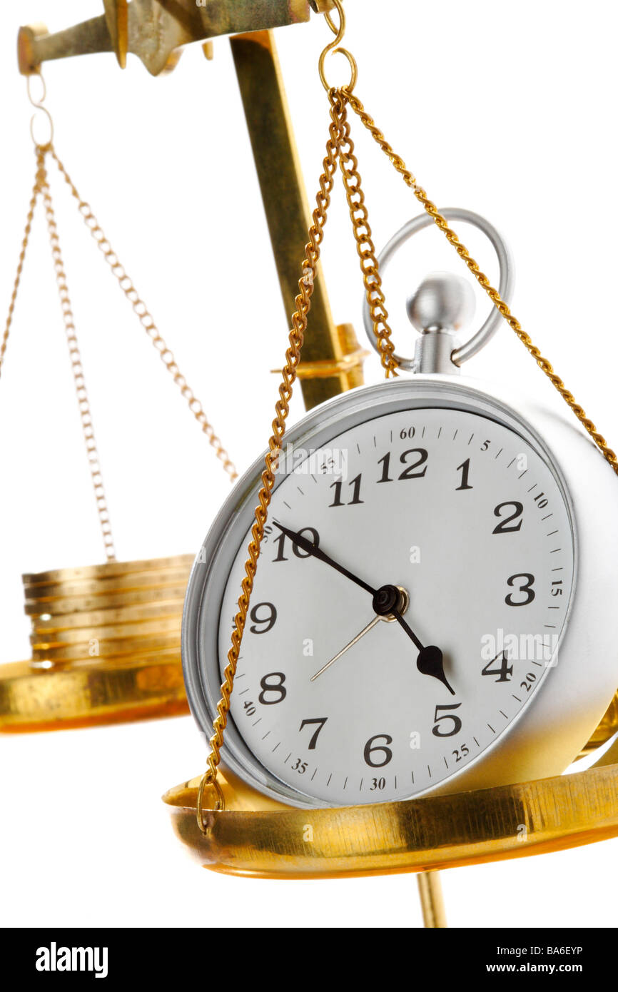 Clock and gold balancing on each hand of balance Stock Photo