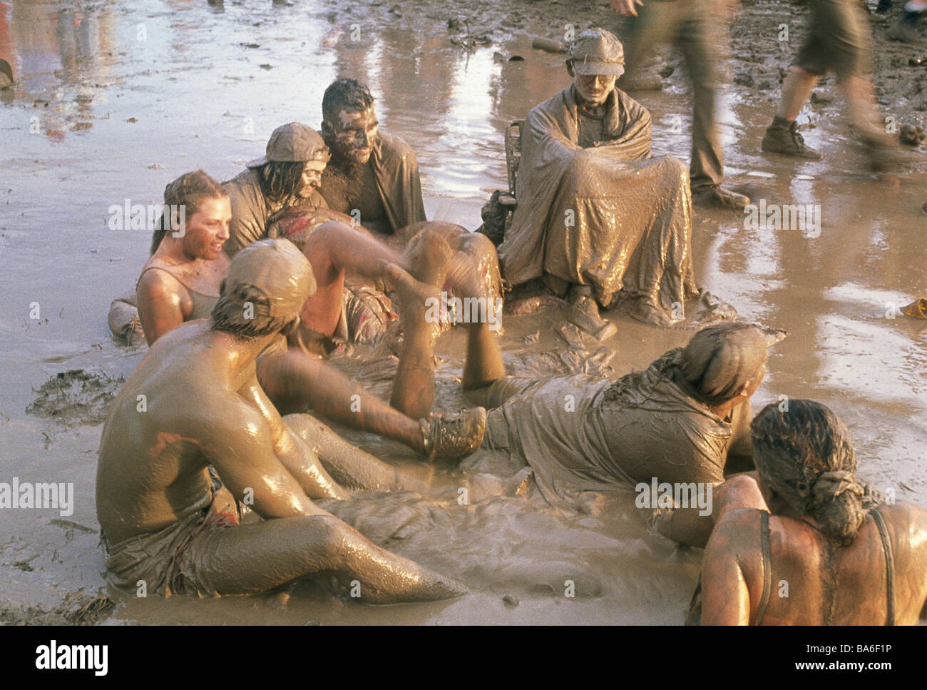 USA Woodstock festival mud people dirty sociability no models release North America party party filth event visitors sits Stock Photo