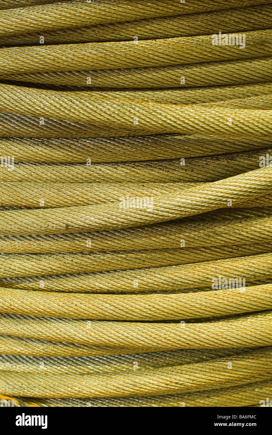 Cable rolled yellow closeup rope metalrope steelrope hawser Zugzeil