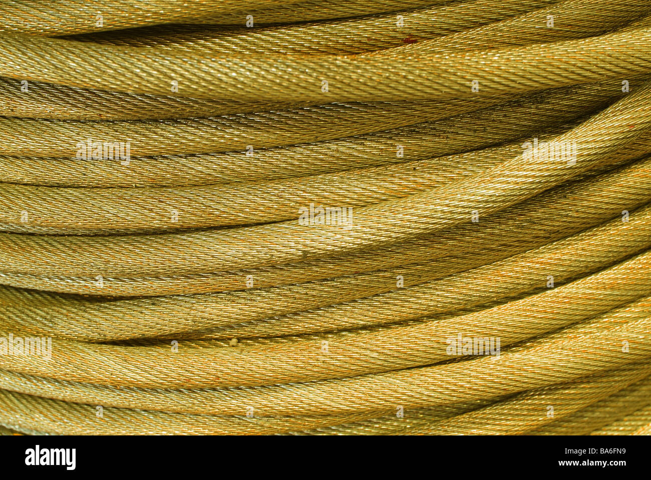 Cable rolled yellow closeup rope metalrope steelrope hawser Zugzeil