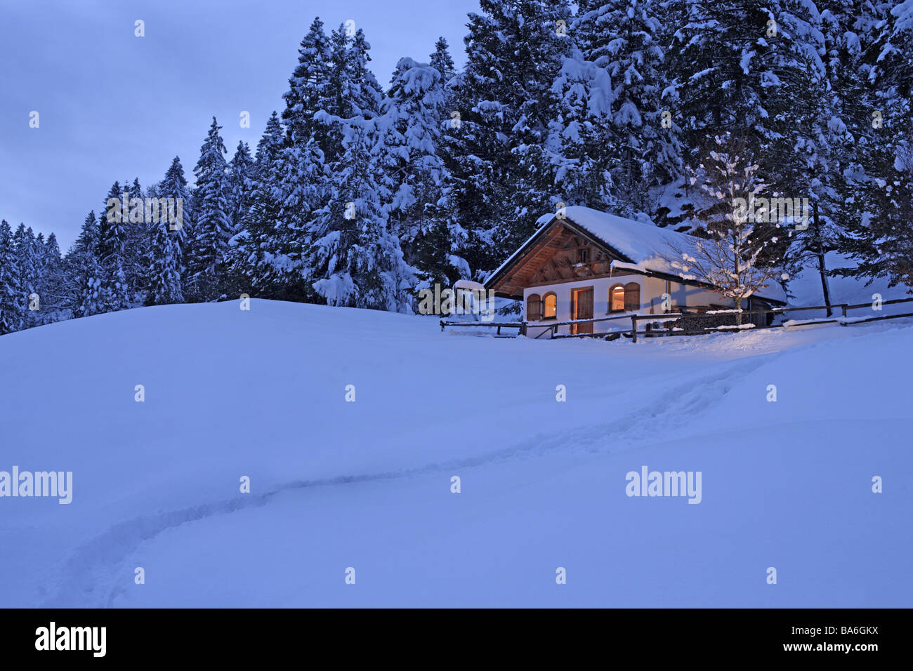 Winter-landscape forest-edge cottage snow way evening landscape trees winters wood-cottage mountains idyllically secluded Stock Photo