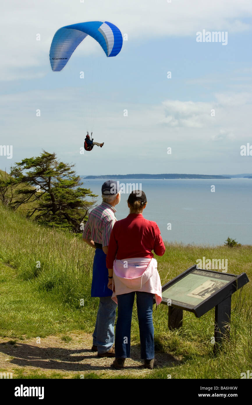Couple watching Paraglider - Fort Ebey State Park, Whidbey Island, Washington Stock Photo