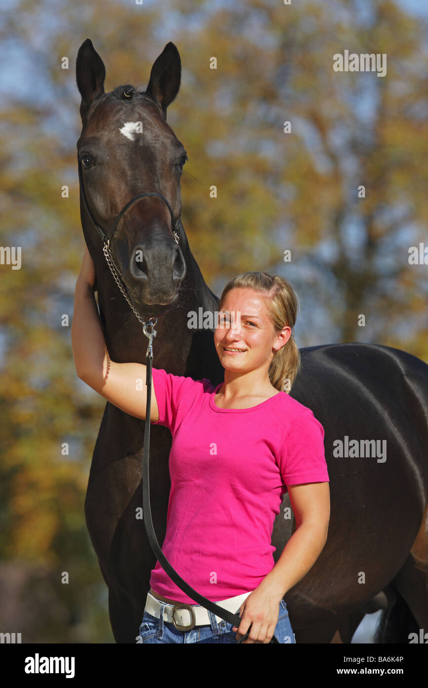 young woman and Austrian Warmblood horse Stock Photo Alamy