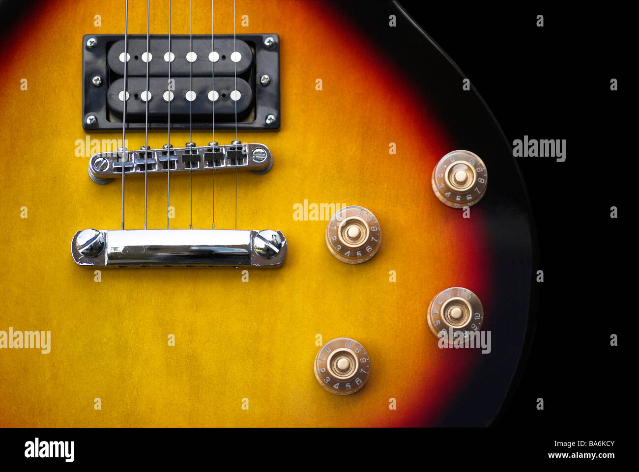 Part of an electric guitar - including strings, pickups, controls Stock Photo