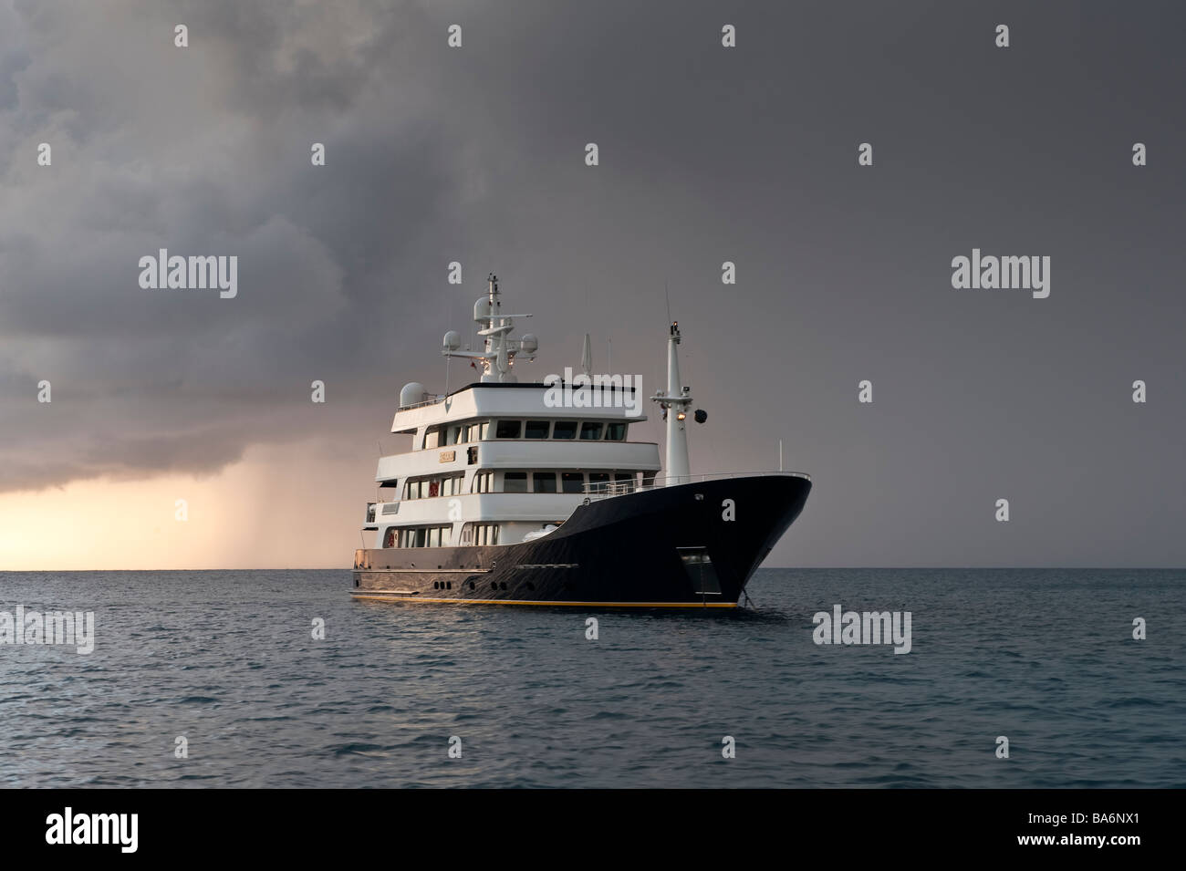Superyacht Big Aron is at anchor off Charleston on a stormy afternoon near sunset Stock Photo