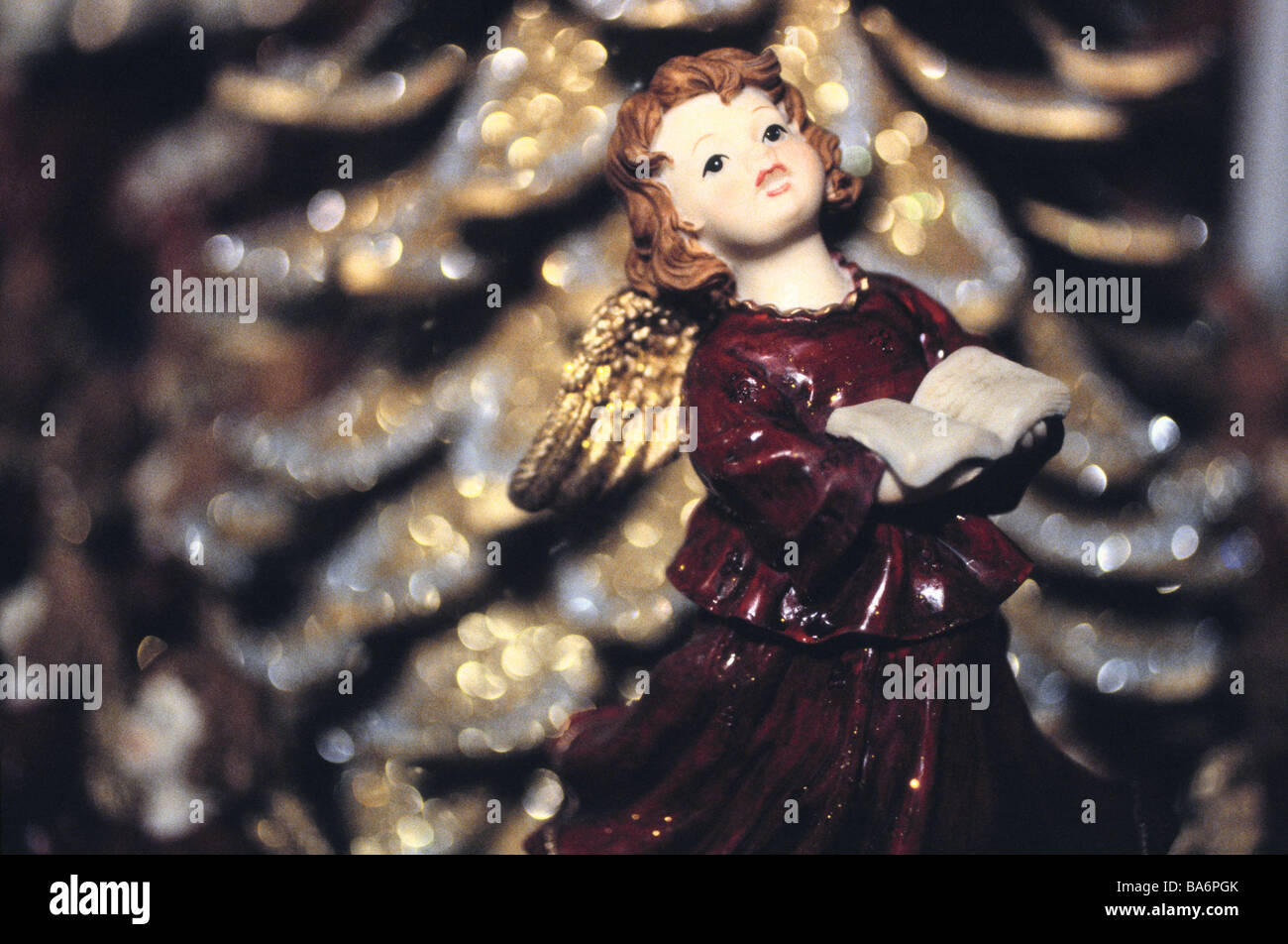 Angel-figure sings book holds background fuzziness figure angels little angels Christmas-angels red symbol Christmas Stock Photo