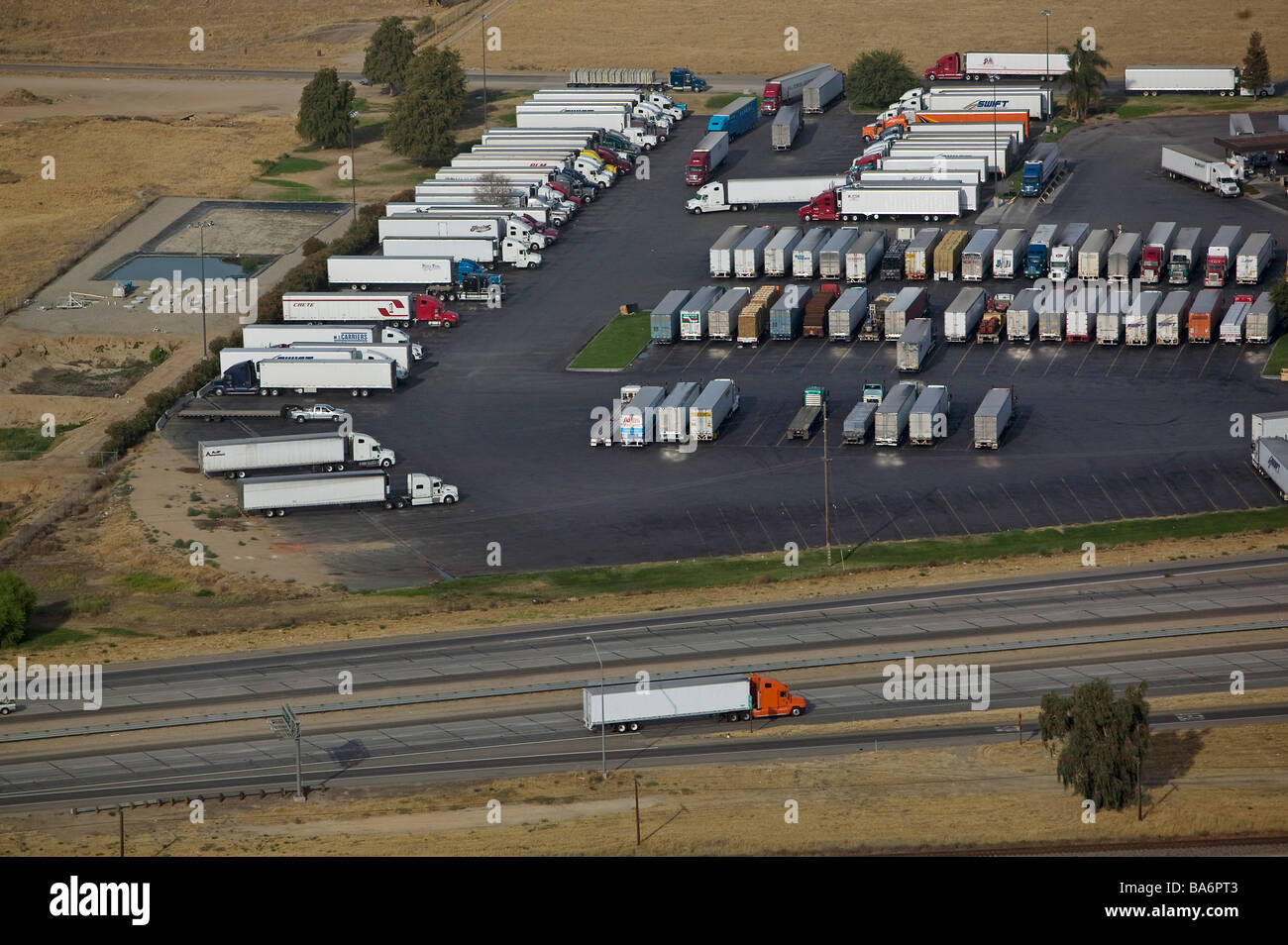 aerial view above trucks containers highway 99 Central Valley