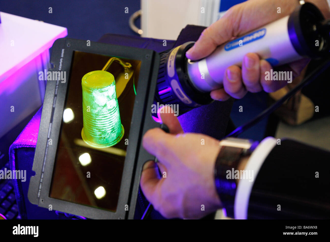 Fingerprints seen with an UV-light torch for police crime scene investigation, IPOMEX, Munster, Germany. Stock Photo