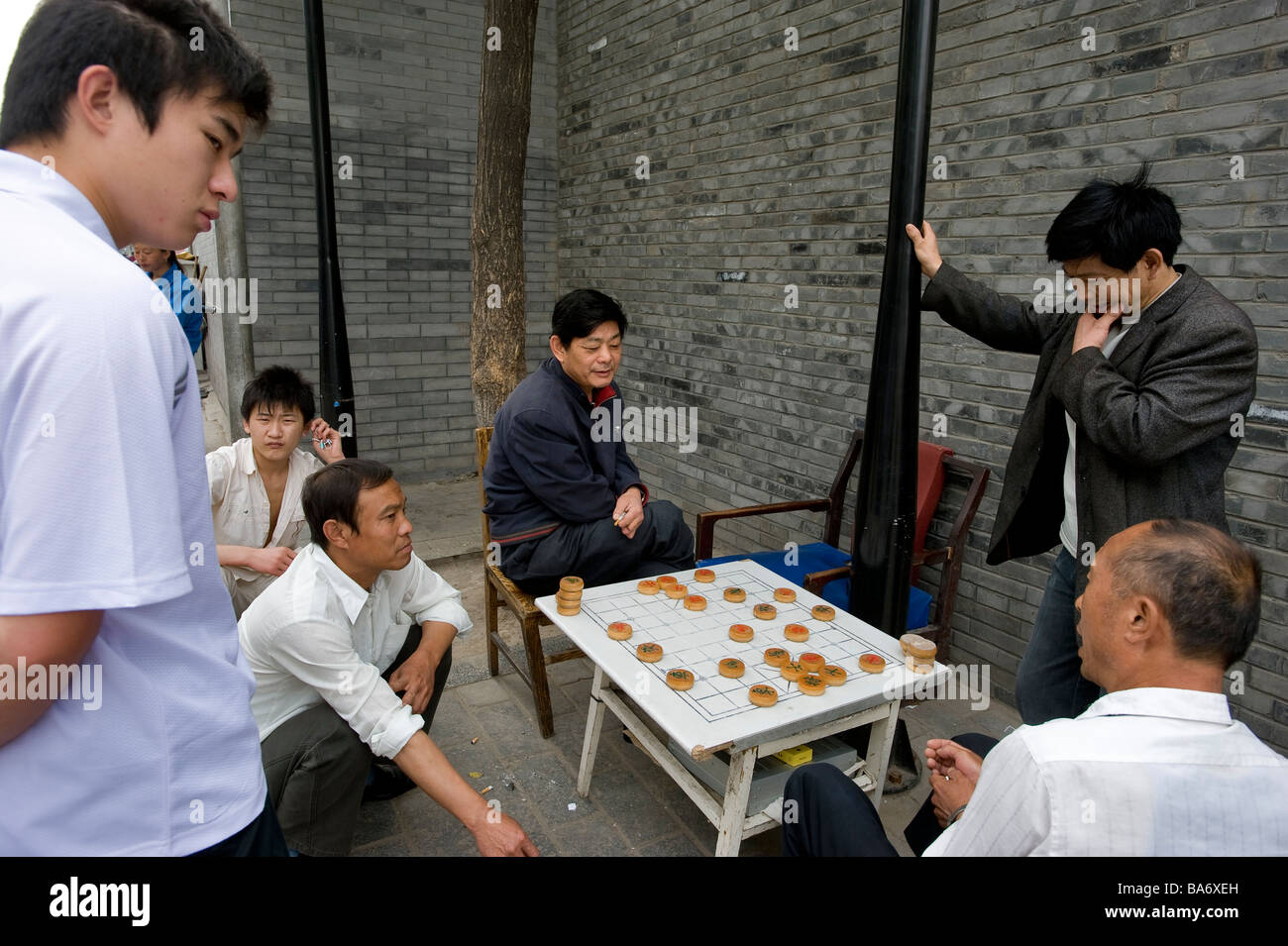 China, Beijing, game of Chinese Chess (Xiangqi) in one of the last Hutongs (ancient streets which are beeing totally Stock Photo