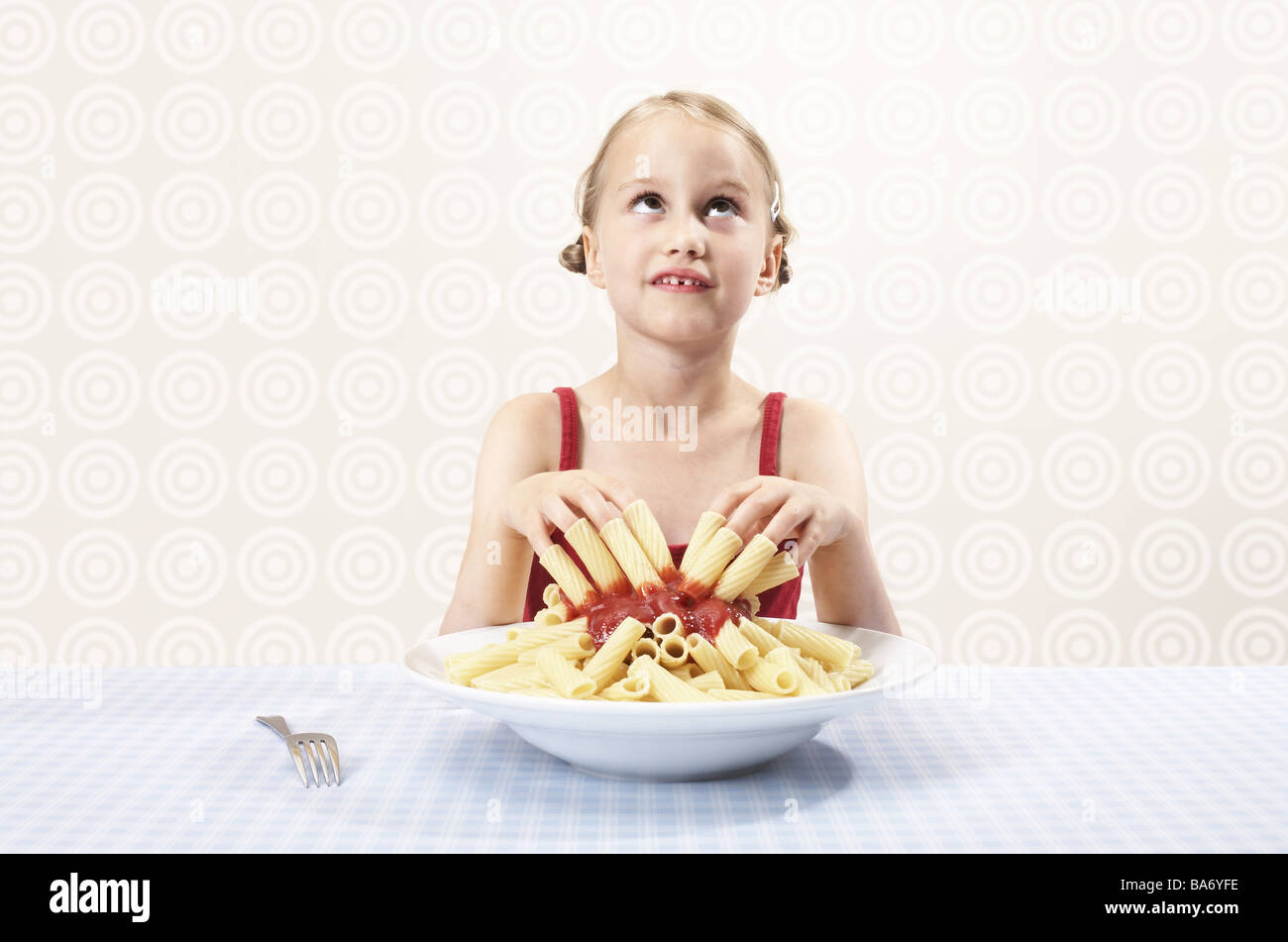 Girls fingers noodles 'Rigatoni' given up tops ketchup dive in high-looks semi-portrait people child child-portrait childhood Stock Photo