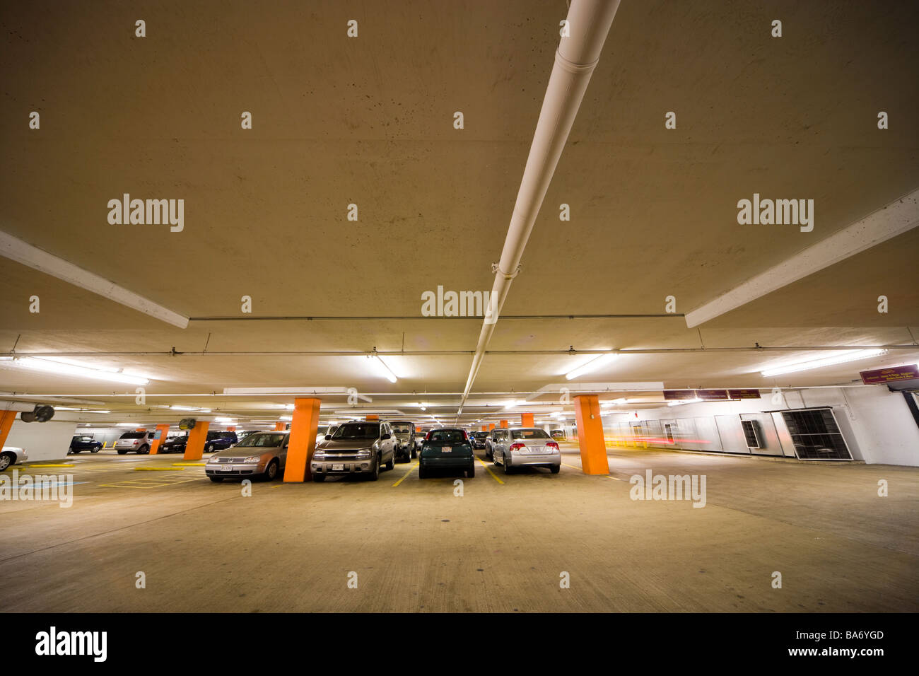 Underground parking garage; multi-story car park; parking structure with cars in Washington DC. Stock Photo