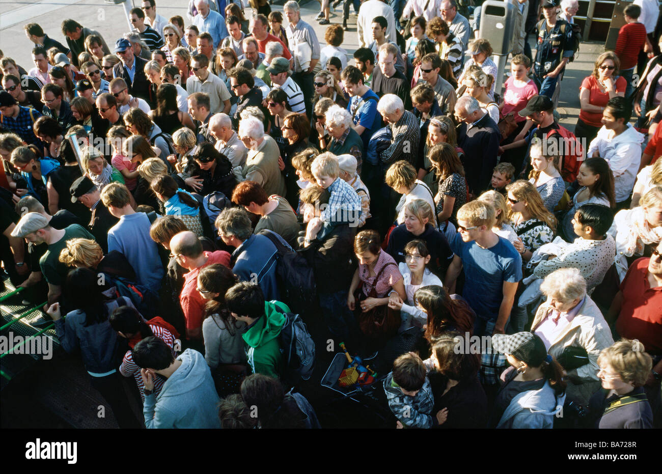 April 10, 2009 - Crowd pushing to board a ferry bound for Landungsbrücken at Neumühlen ferry pier in the German city of Hamburg. Stock Photo